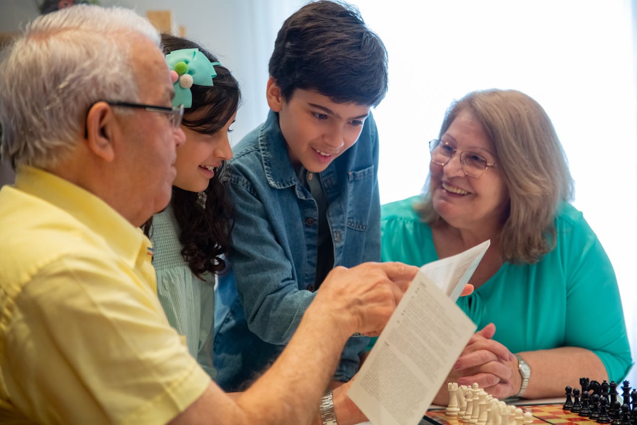 Happy family moments with grandparents and grandchildren enjoying time together indoors.